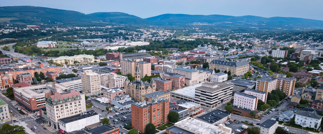 Aerial photo of downtown Scranton, surrounded by mountains.